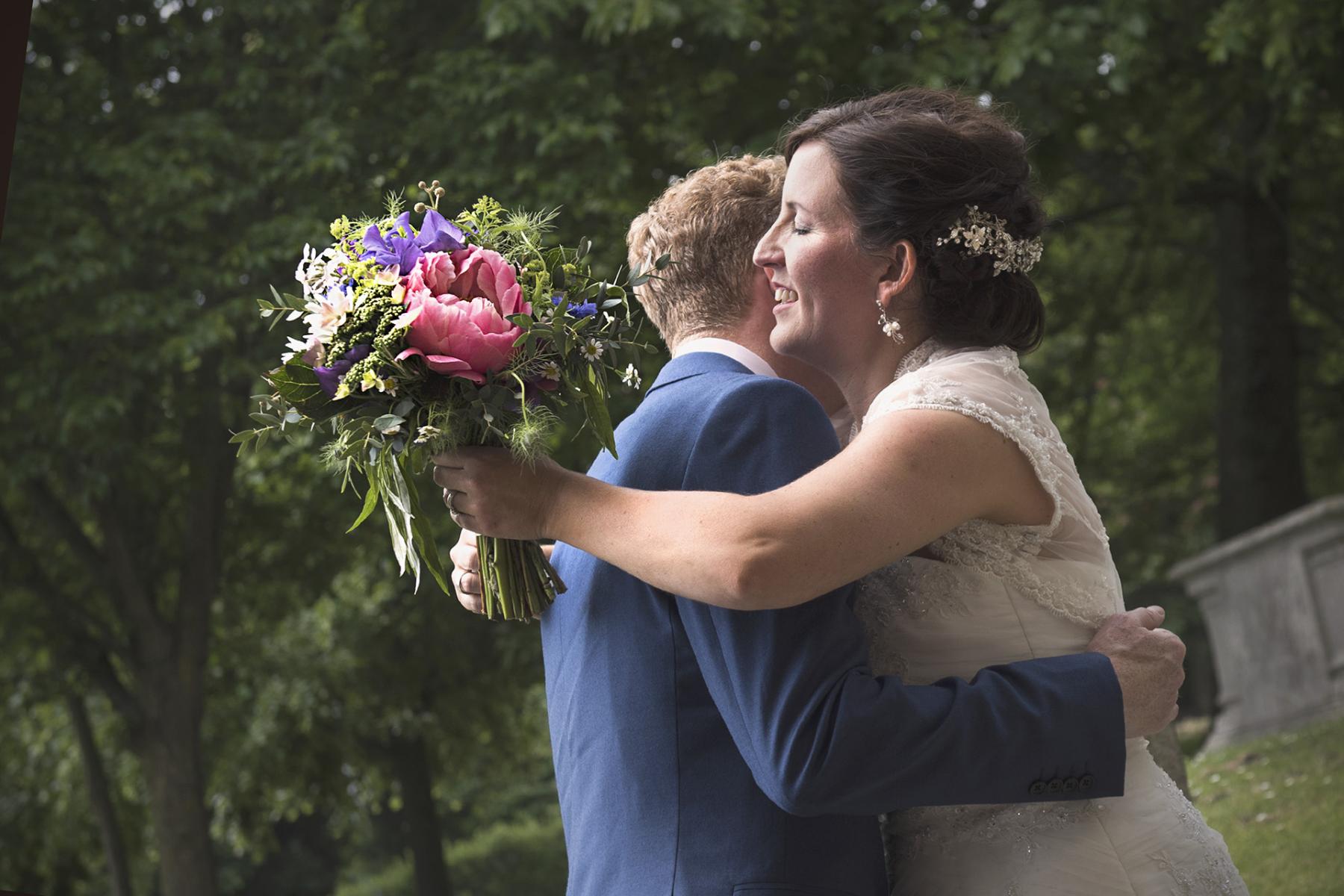 bride-groom-hug-summer-wedding-photography-south-wales-wedding-photographer