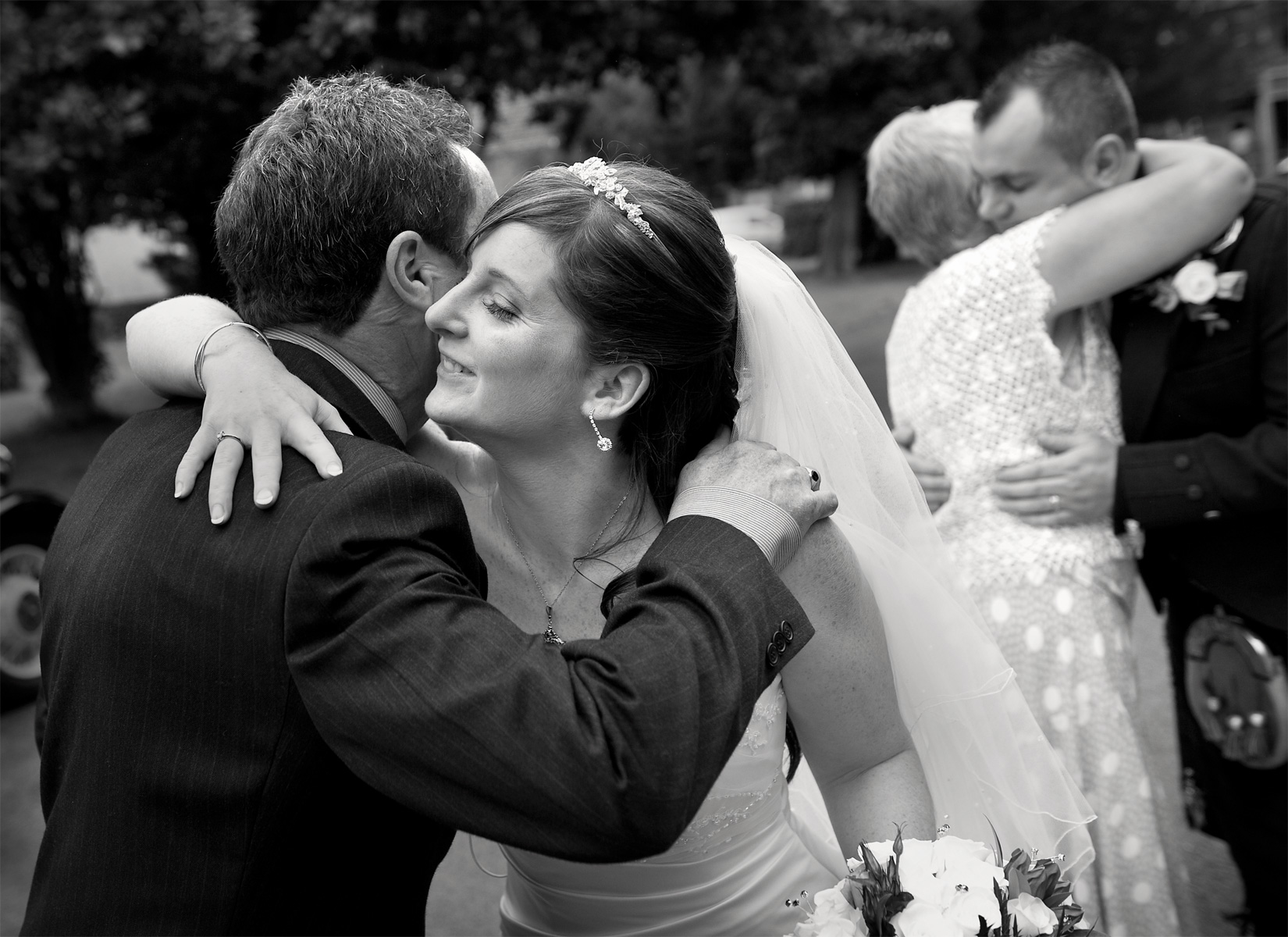 South-wales-reportage-wedding-photographers-bride-hugging-guest-Aberdare-wedding-photography.