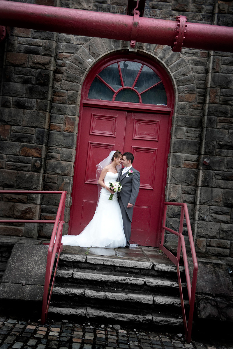 Pontypridd-wedding-photography-Bride-and-Groom-red-doorway-Rhondda-Heritage-center-wedding-photographer